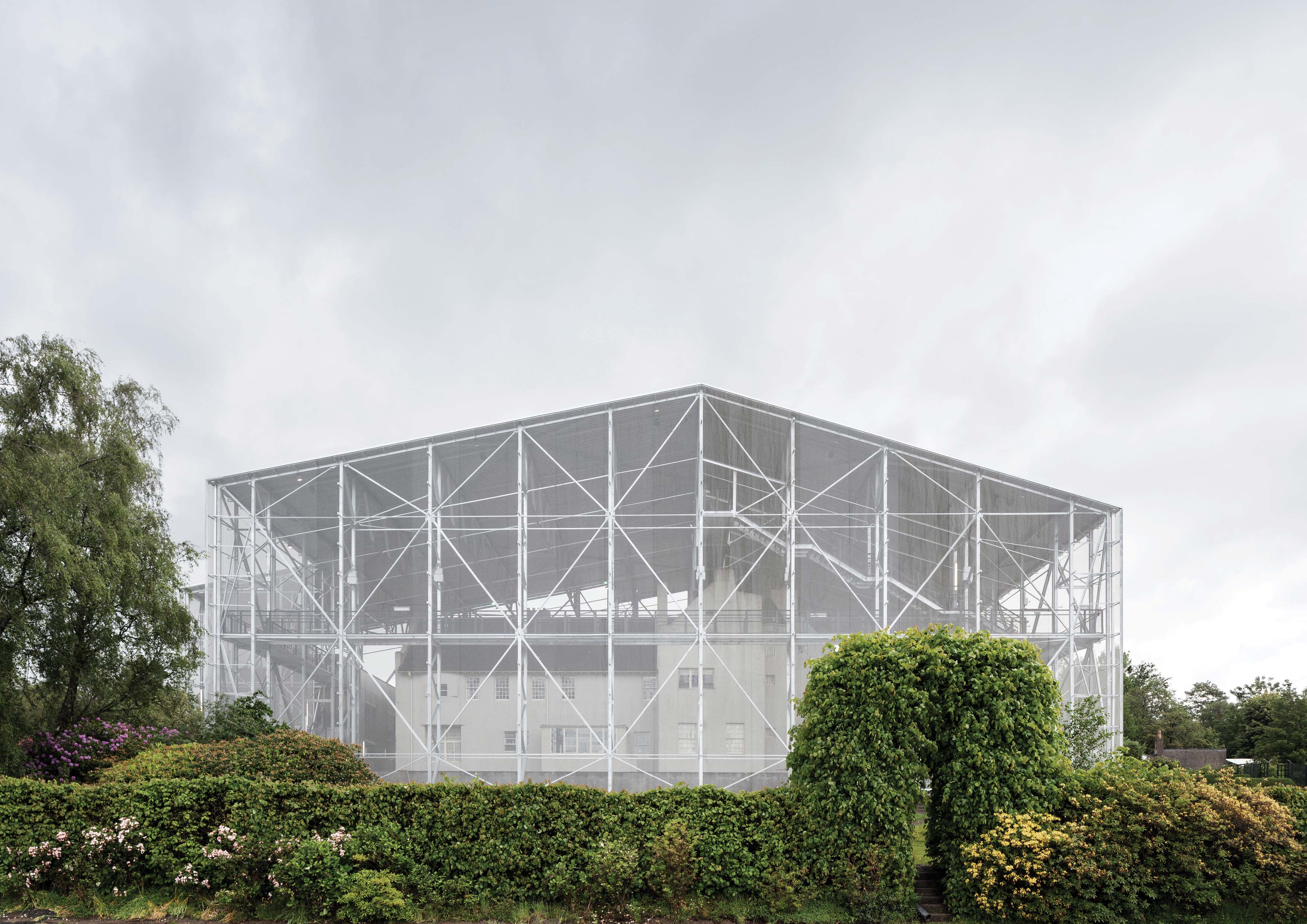 A temporary ‘big-box’ museum contains and protects the Hill House whilst a conservation programme takes place