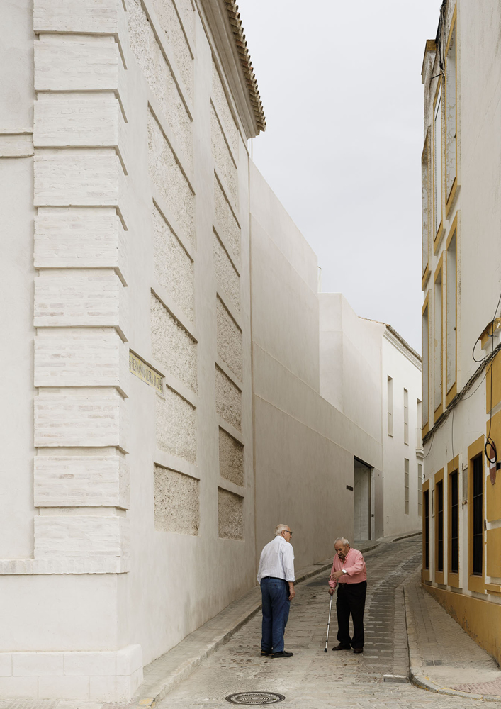 Cover Photo - The hermetic and massive character of the new facade contrasts with the lightness of the volume, which is subtly staggered in section as it ascends.
